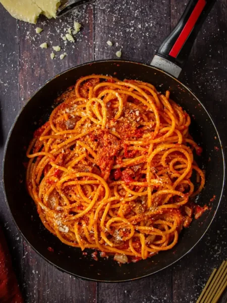 Spaghetti all’Amatriciana with crispy guanciale, tomatoes, and Pecorino Romano