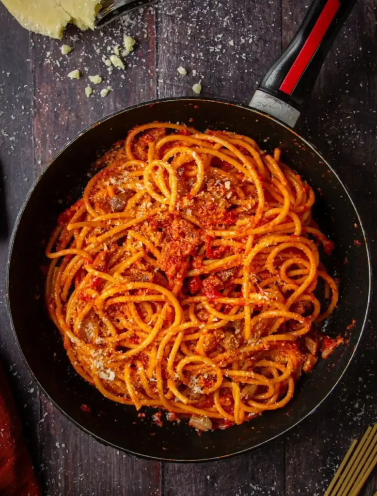 Spaghetti all’Amatriciana with crispy guanciale, tomatoes, and Pecorino Romano